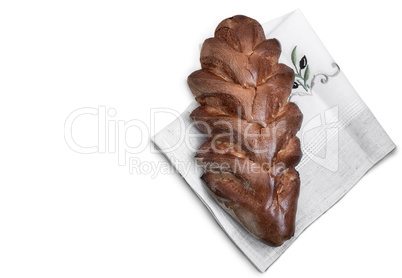 Appetizing sweet white bread on a napkin on a white background.