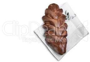 Appetizing sweet white bread on a napkin on a white background.