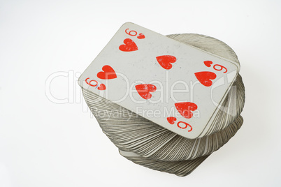 Six of Hearts at the top of playing card deck
