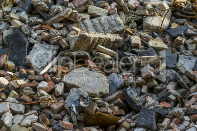Pile of rubbish, demolished house, background.