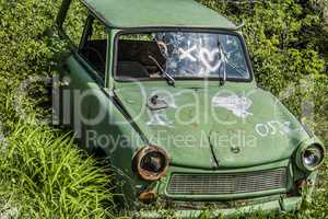 Rusty abandoned vintage green Trabant.