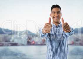 man smiling with thumbs up