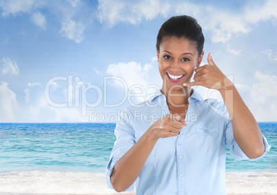 woman smiling and pointing with ring me sign