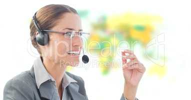 Travel agent woman wearing headset in front of world map