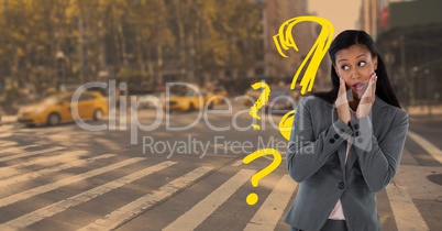 Confused or surprised woman looking left and holding her head in a city with question marks
