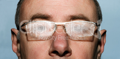 A man in dusty glasses