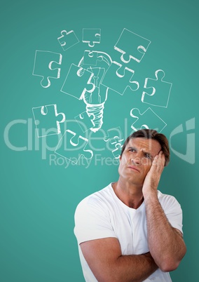 Confused man frowning and holding his head looking up and a drawing