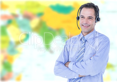 Travel agent man wearing headset in front of world map