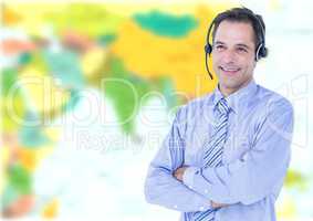 Travel agent man wearing headset in front of world map