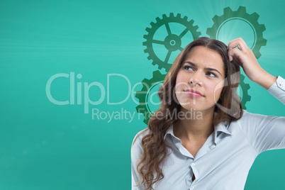 Confused woman scratching her head looking up with cogs