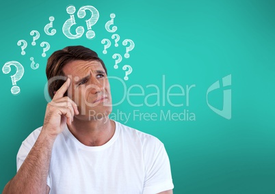 Confused man frowning and scratching his head looking up with question marks