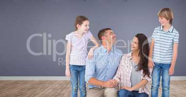 Family together with purple wall in room