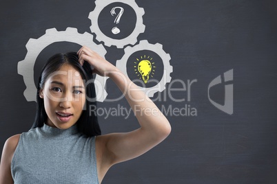 Confused woman scratching her head with cogs and drawings