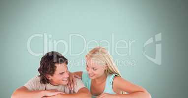 Couple laughing with blue background