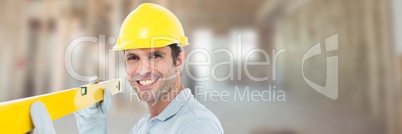 Construction Worker on building site holding spirit level