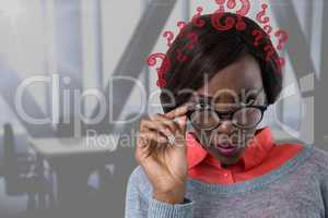 Confused woman holding her glasses with question marks in an office