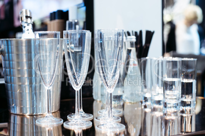 Empty glasses on table in night club or restaurant, closeup