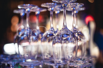 Empty glasses on table in night club or restaurant, closeup