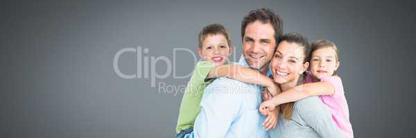 Family close together with grey background