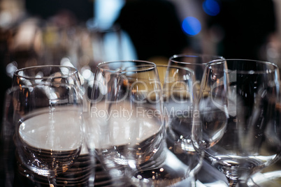 Empty glasses on table in night club or restaurant, closeup