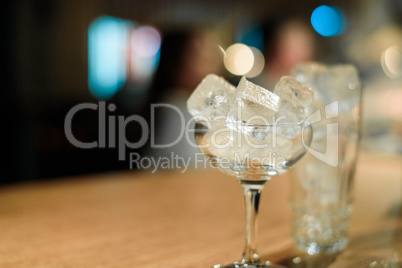 Empty glasses on table in night club or restaurant, closeup