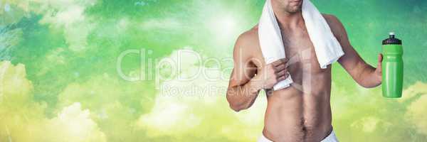 Fit strong Man with green background holding flask drink