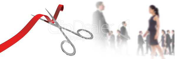 Scissors cutting ribbon with business people