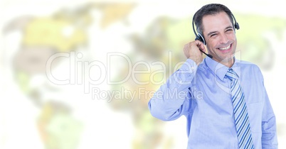 Travel agent man wearing headset in front of world map