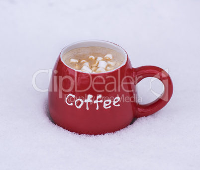 red ceramic mug with black coffee