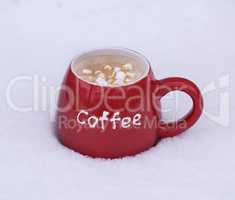 red ceramic mug with black coffee