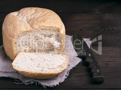 round yeast bread and a kitchen knife