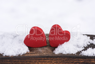 two red wooden hearts