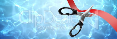 Scissors cutting ribbon with water