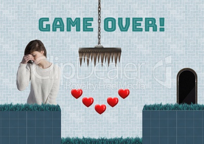 Game over text and woman in Computer Game Level with hearts and traps