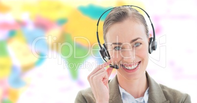 Travel agent woman wearing headset in front of world map