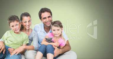 Family holding each other with green background