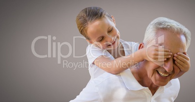 Grandfather and daughter having fun playing with brown background