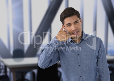 man smiling with ring me sign