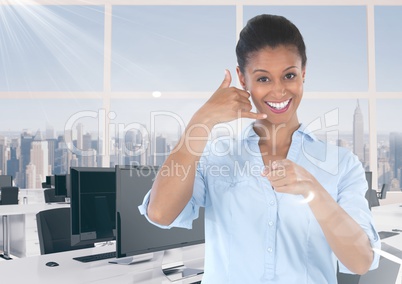 woman in office smiling with ring me sign