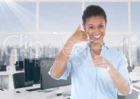 woman in office smiling with ring me sign