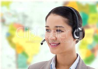 Travel agent woman wearing headset in front of world map