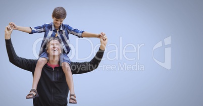 Father and son having fun playing with blue background