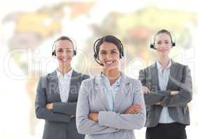 Travel agents wearing headset in front of world map