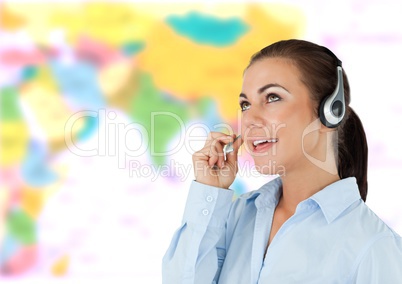 Travel agent woman wearing headset in front of world map