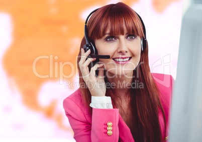 Travel agent woman wearing headset in front of world map