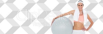 Fit athletic woman with diamond shapes holding exercise ball