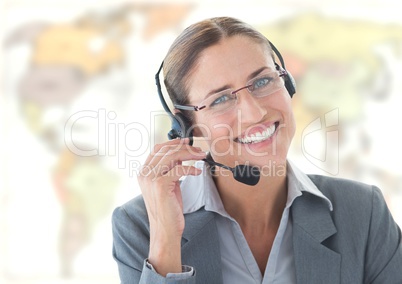 Travel agent woman wearing headset in front of world map