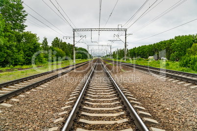 Train tracks go over the horizon line