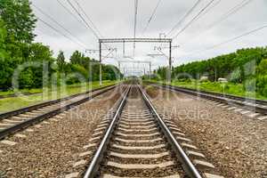 Train tracks go over the horizon line