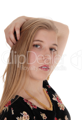 Beautiful woman standing with hand on head